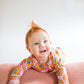'Born to Be Bright' Rainbow Zippie Romper